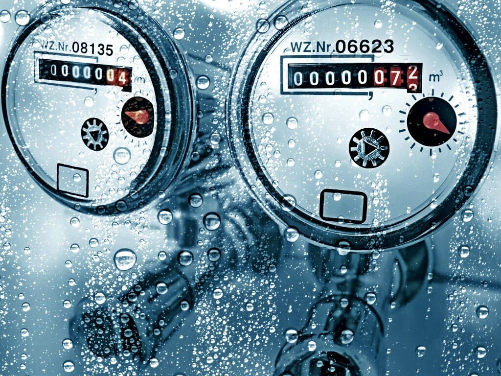 Water counter meter representing cooling tower scale inhibitor
